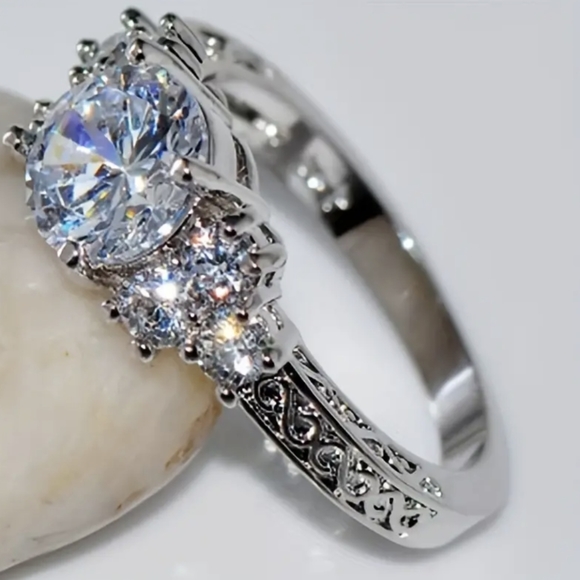 NEW silver tone circular zircon w/small inlaid zircons on the sides ring - Picture 3 of 10